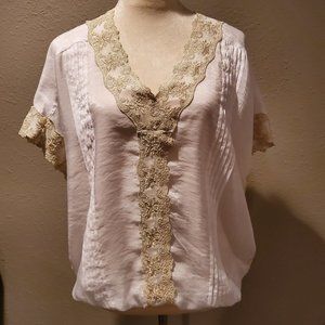 White top with gold accents